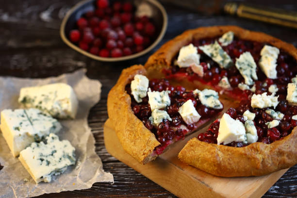 Homemade galette with cranberries and blue cheese. stock photo