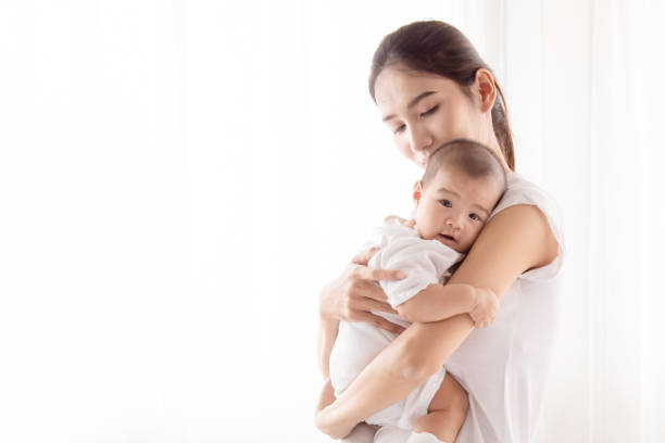 beautiful asian mother hold and embrace her todlder mom looking her baby with love and tender - Lansinoh Nipple Protectors: A Lifeline for Breastfeeding Mothers