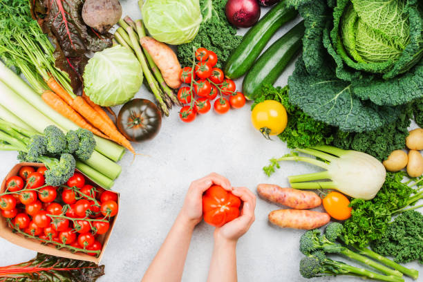 istock Variety of organic vegetables on blue table 1433981018
