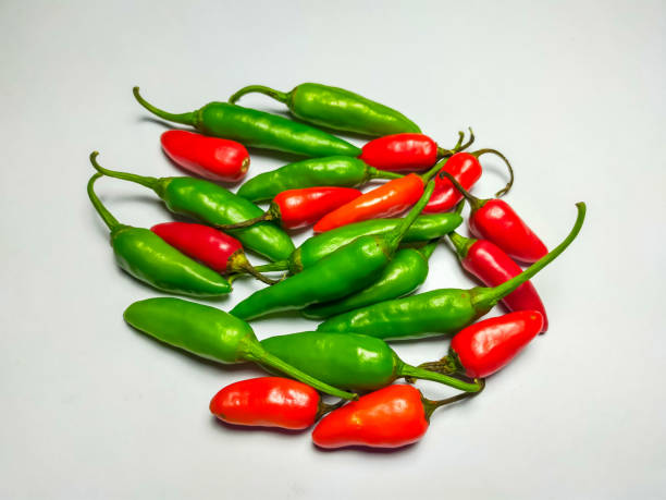 istock Mixed red chili and green chili pile on white background. 1434018022