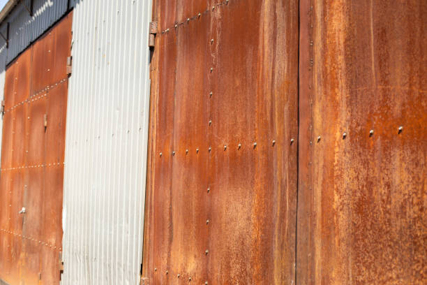 istock Rusty gates. More of gate to warehouse. Old wall. 1434023491