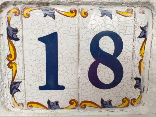 istock Eighteen,18 in number on a white ceramic tile with borders. 1434027493