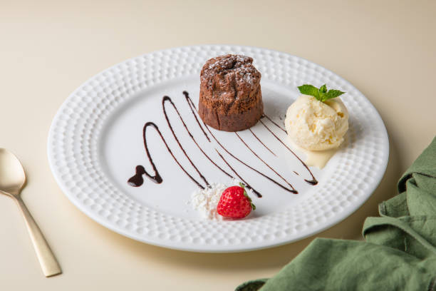 istock white plate and cake, Tiny cupcake with strawberry on top of a gray concrete background. 1434028285
