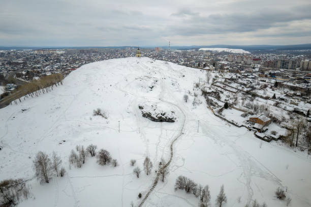 Flight over Lisya mountain or Fox mountain in the city of Nizhny Tagil, Russia. Aerial view Flight over Lisya mountain or Fox mountain in the city of Nizhny Tagil. Russia. Aerial view. Nizhny Tagil, Russia lisya bay stock pictures, royalty-free photos & images
