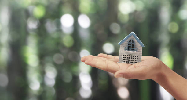 istock House Residential Structure in  hand ,business home idea 1434041346