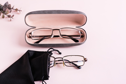 Storage concept - broken glasses in a soft case and whole glasses in a hard case side by side