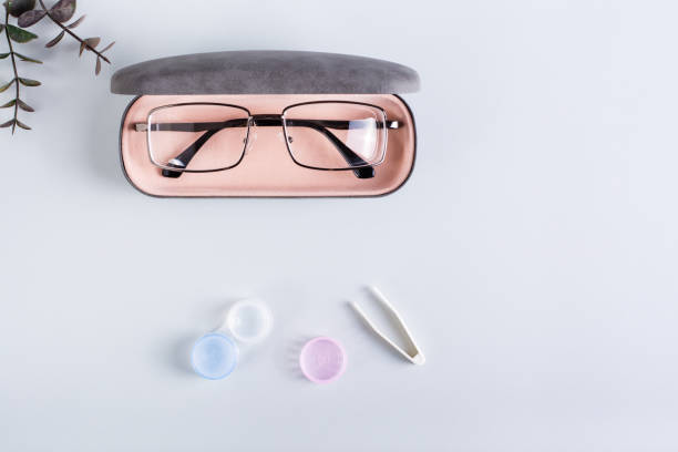 istock A case with glasses, an open container with contact lenses and tweezers. Top view. 1434042419
