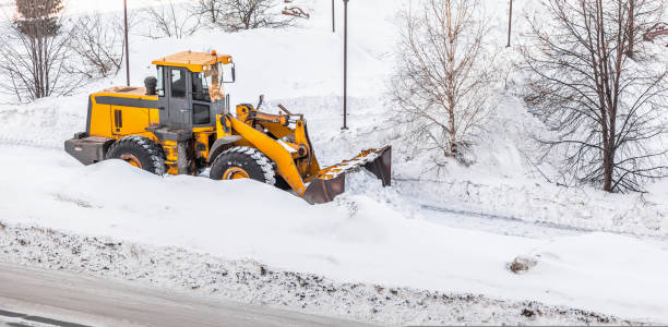 istock Snow clearing. Tractor clears the way after heavy snowfall. 1434043091