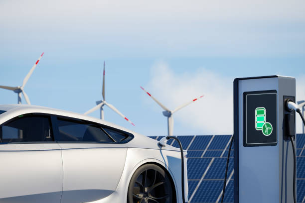 Modern sports electric car charging on background of solar panels. EV station with port plugged in environmentally friendly vehicle. Realistic 3d Rendering renewable energy concept solar wind power. carga de coches eléctricos deportivos modernos sobre el fondo de paneles solares. estación ev con puerto enchufado en vehículo respetuoso con el medio ambiente. representación realista en 3d del concepto de energía renovable de energía eólica solar