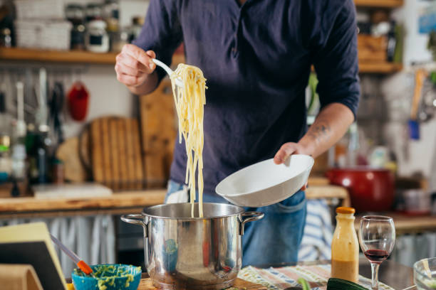 istock man prepares food at home 1434048194