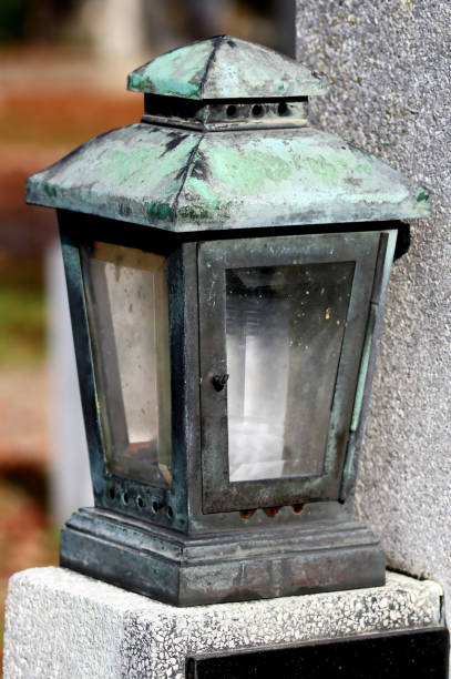 istock Grave Lantern, old, all saints day, patinated copper, black and green, old graveyard 1434048832