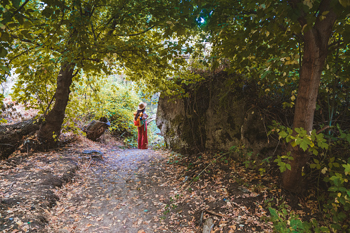 Traveler young girl is walking between trees  in Ihlara valley , Peristrema Valley in Aksaray Turkey