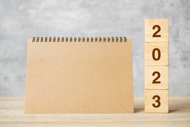 istock 2023 Happy New Year with blank notebook and wooden number. countdown, Resolution, Goals, Plan, Action and Mission Concept 1434055266
