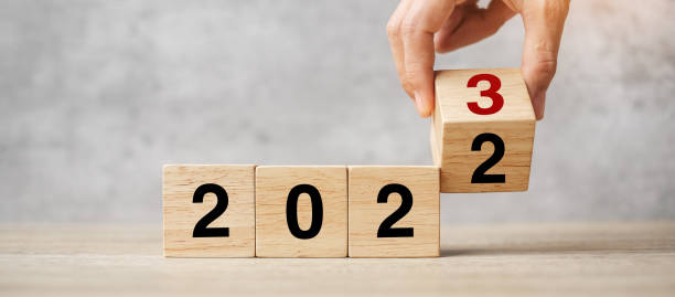 istock hand flipping block 2022 to 2023 text on table. Resolution, strategy, plan, goal, motivation, reboot, business and New Year holiday concepts 1434055288