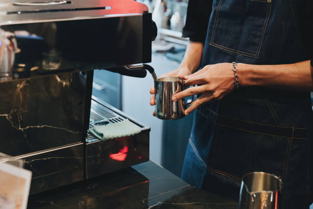 istock Asian male barista making coffee for customers 1434057359
