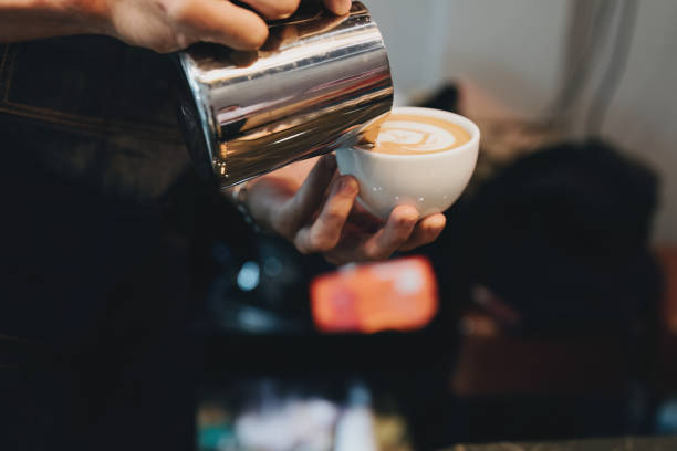 istock Asian male barista making coffee for customers 1434057431