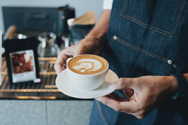 istock Asian male barista making coffee for customers 1434057609