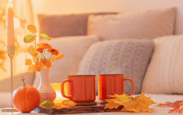 istock two orange cups with hot drink in autumnal light interior 1434057761