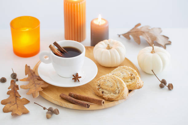 istock white cup of coffee with cozy decor on white table 1434057784