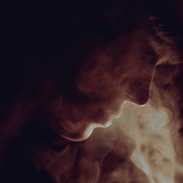 istock Young woman profile view in the smoke 1434057946