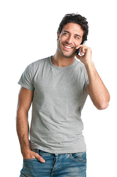 Fun at phone Happy smiling young man talking on mobile isolated on white background. looking around stock pictures, royalty-free photos & images