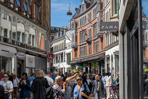 Copenhagen, Denmark - July 11, 2022: People on main pedestrian and shopping street called Stroget in historic city centre