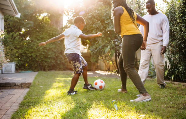 istock African family playing soccer in their backyard 1434062468