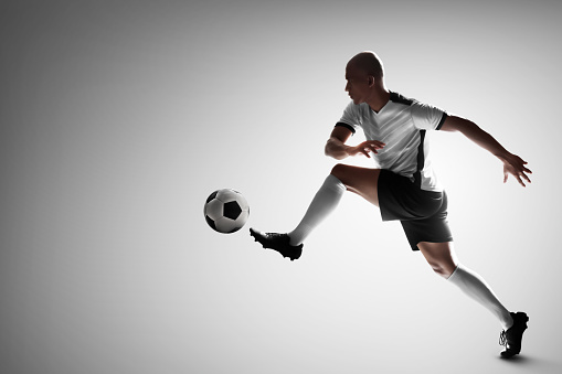 Soccer player isolated on white background