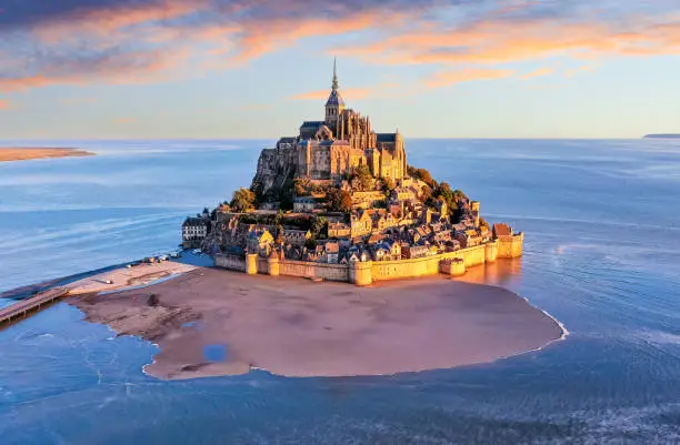 Mont Saint-Michel. Aerial view from the southeast during sunrise. Normandy, France.