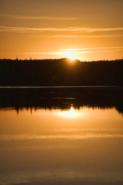 istock Sunset with reflection on a Swedish lake in Smalland. Romantic evening mood 1434065338