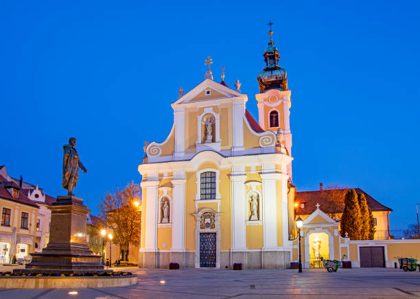 Gyor, city in Hungary,  baroque Carmelite church by night