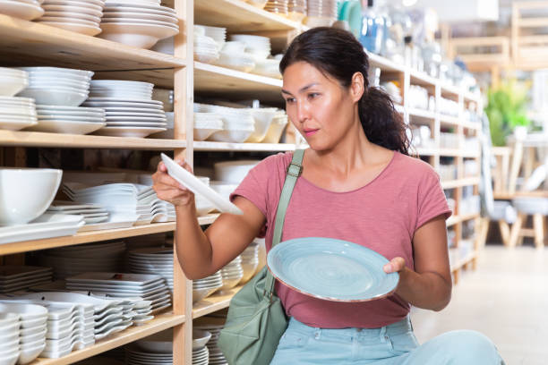 istock Woman choosing plates in store 1434066678