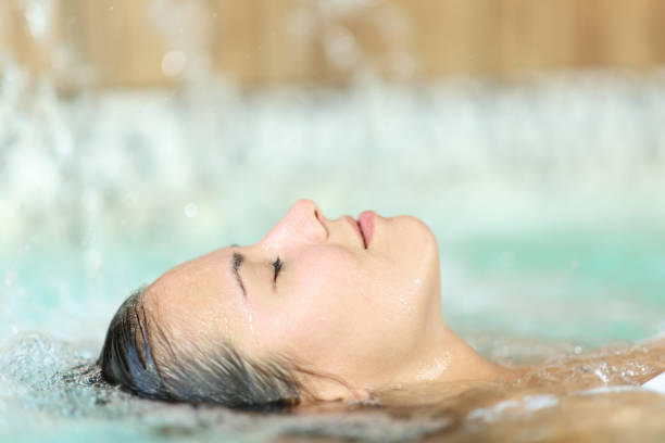 istock Woman floating and relaxing in a spa pool 1434066855