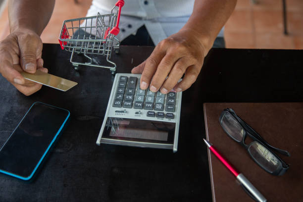 istock businessman using calculator tax in office. 1434067205