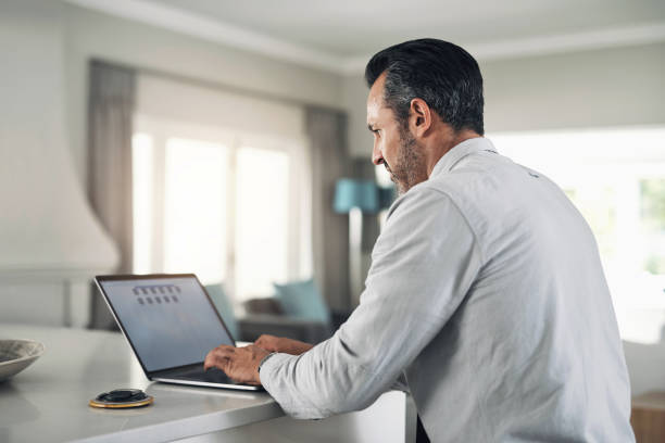 istock Laptop, typing businessman with work from home email writing, remote work planning and working on a corporate report with house wifi. Entrepreneur or manager search software tech management app on pc 1434068374