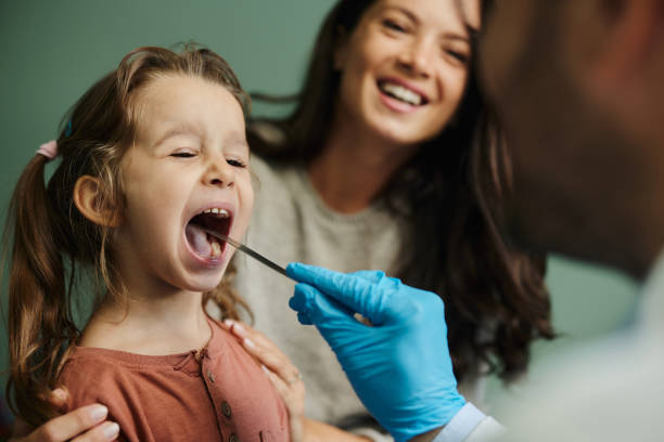 istock Throat exam at pediatricians'! 1434072164