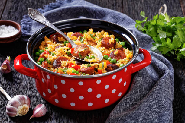 istock smoked sausages with rice and vegetables, top view 1434073933