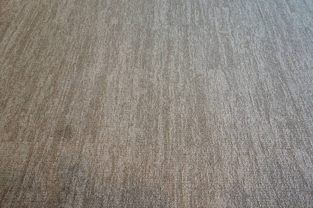 istock A carpet floor mat texture background blank.  light brown color. 1434075121
