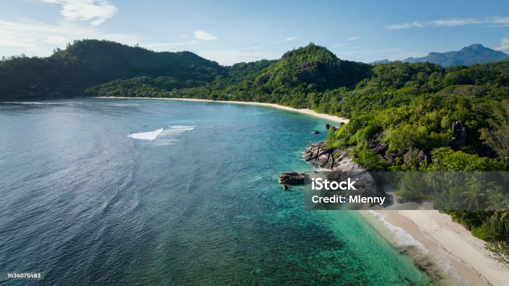 Seychelles Bay Lazare Beach Panorama Mahé Island Baie Lazare Beach Panorama Mahe Island. Drone Point of View. Natural Beach on Mahé Island with typical seychellois boulder rocks on the white sandy beach waterfront. DJI Mavic 3 Drone Stitched Panorama. Baie Lazare Beach, Takamaka, Mahé Island, Seychelles, East Africa Beach Stock Photo