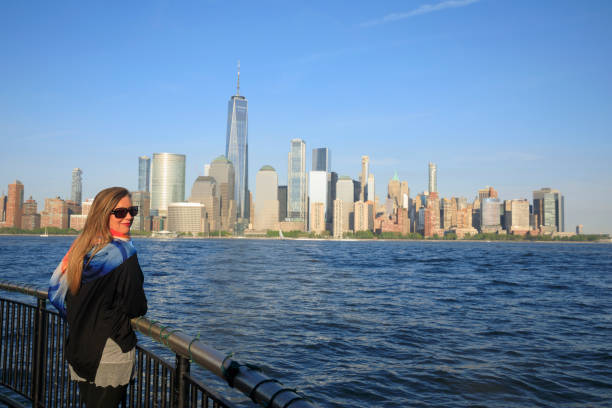Pretty active women Long blonde hair enjoying in Panorama of New York City skyline Lower Manhattan Pretty active women Long blonde hair enjoying in Panorama of New York City skyline Lower Manhattan and the Freedom Tower Panoramic new york marathon photos stock pictures, royalty-free photos & images