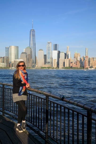 Pretty active women Long blonde hair enjoying in Panorama of New York City skyline Lower Manhattan Pretty active women Long blonde hair enjoying in Panorama of New York City skyline Lower Manhattan and the Freedom Tower new york marathon photos stock pictures, royalty-free photos & images