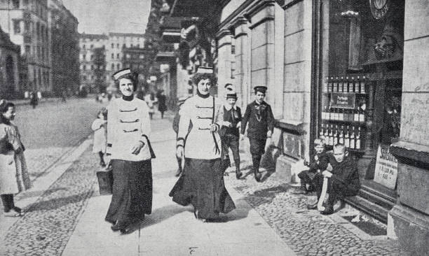 istock Uniformed messengers errand girls in Berlin walking fast on the sidewalk 1434075734