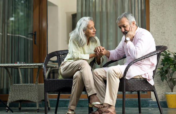 istock Wife comforting old husband suffering with depression 1434075803