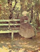 istock Young woman sitting on a bench in the park, reading a book 1434078209