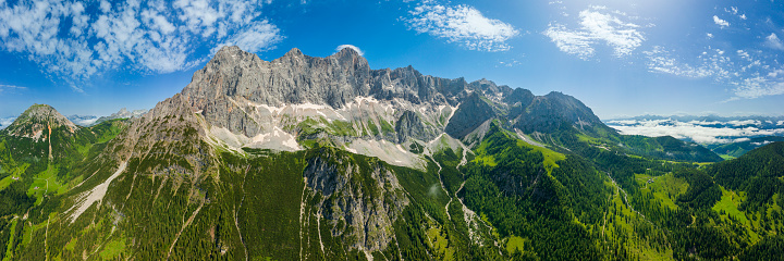 Rhone Glacier View in Summer with famous Furka Pass, a mountain pass - serpentine road in the Swiss Alps connecting the villages and towns of Gletsch & Valais with Realp and Uri. The famous Furka Pass was used as a location in the James Bond film Goldfinger. Drone Point of view towards Rhone Glacier Mountain Range. Stiched XXXL Panorama. Rhone Glacier Mountain Peaks, Furka Pass, Rhone Valley, Canton Valais, Switzerland, Europe