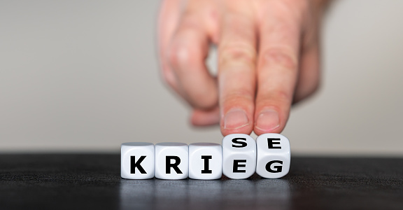 Dice form the German words 'Krieg' (war) and 'Krise' (crisis).