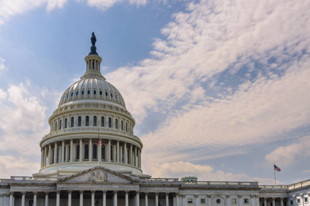 istock Close up of US Capitol Building dome with cloud sky 1434080560