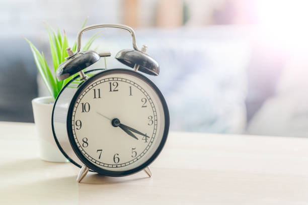 istock Morning sun. Alarm clock on a beautiful background 1434081776