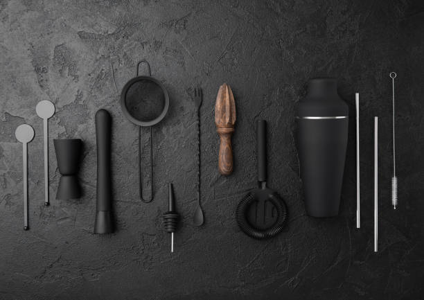 istock Various cocktail,bar utensils black matt steel set on black.Shaker,strainer,spoon,jigger with silver straw and wooden juicer. 1434082229