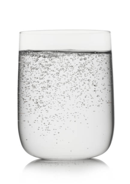 istock Sparkling mineral water in large glass on white background. 1434083232